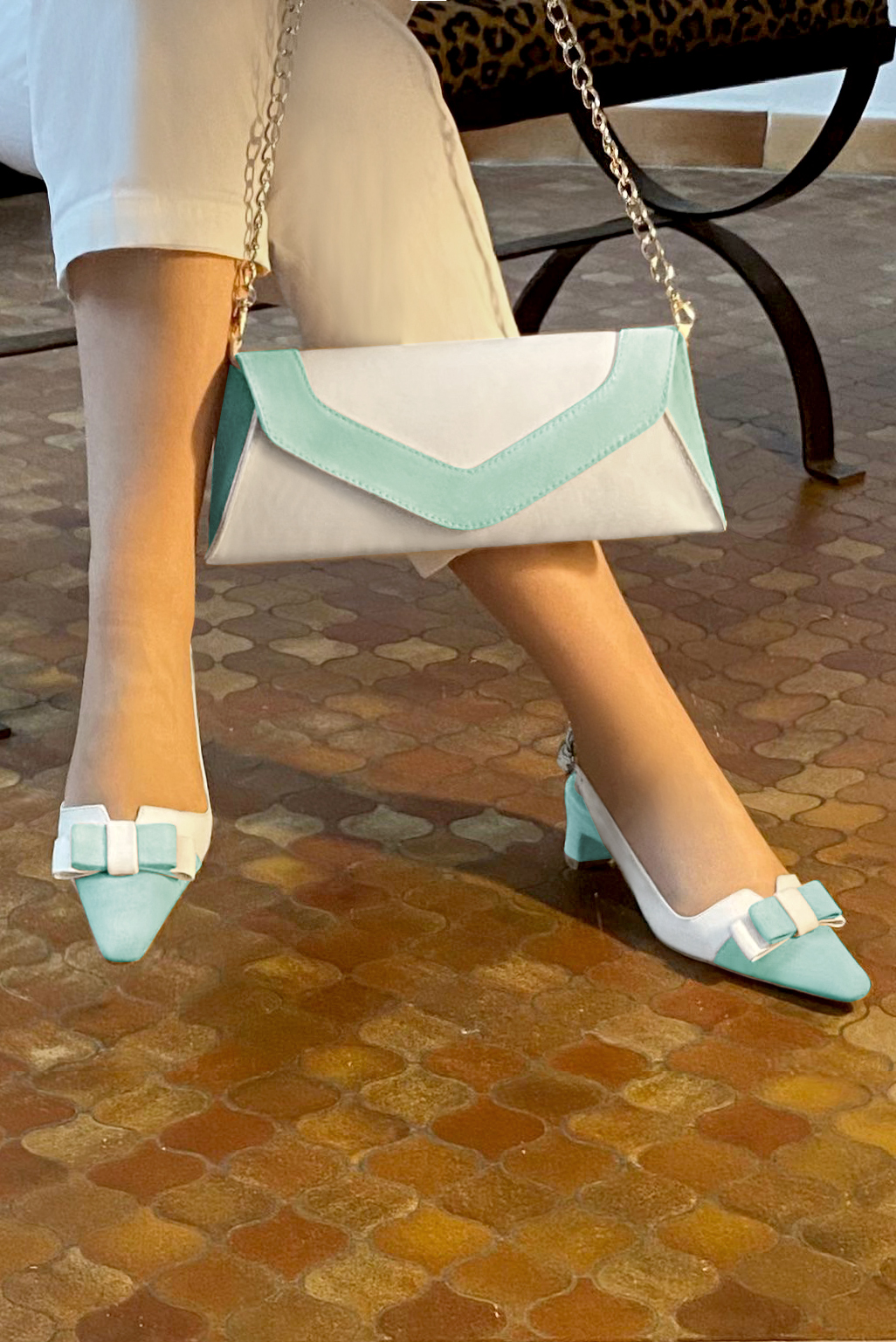 Aquamarine blue and off white women's open back shoes, with a knot. Tapered toe. Low kitten heels. Worn view - Florence KOOIJMAN